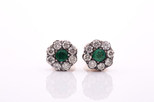Lot 92 - A pair of diamond and emerald floral cluster...