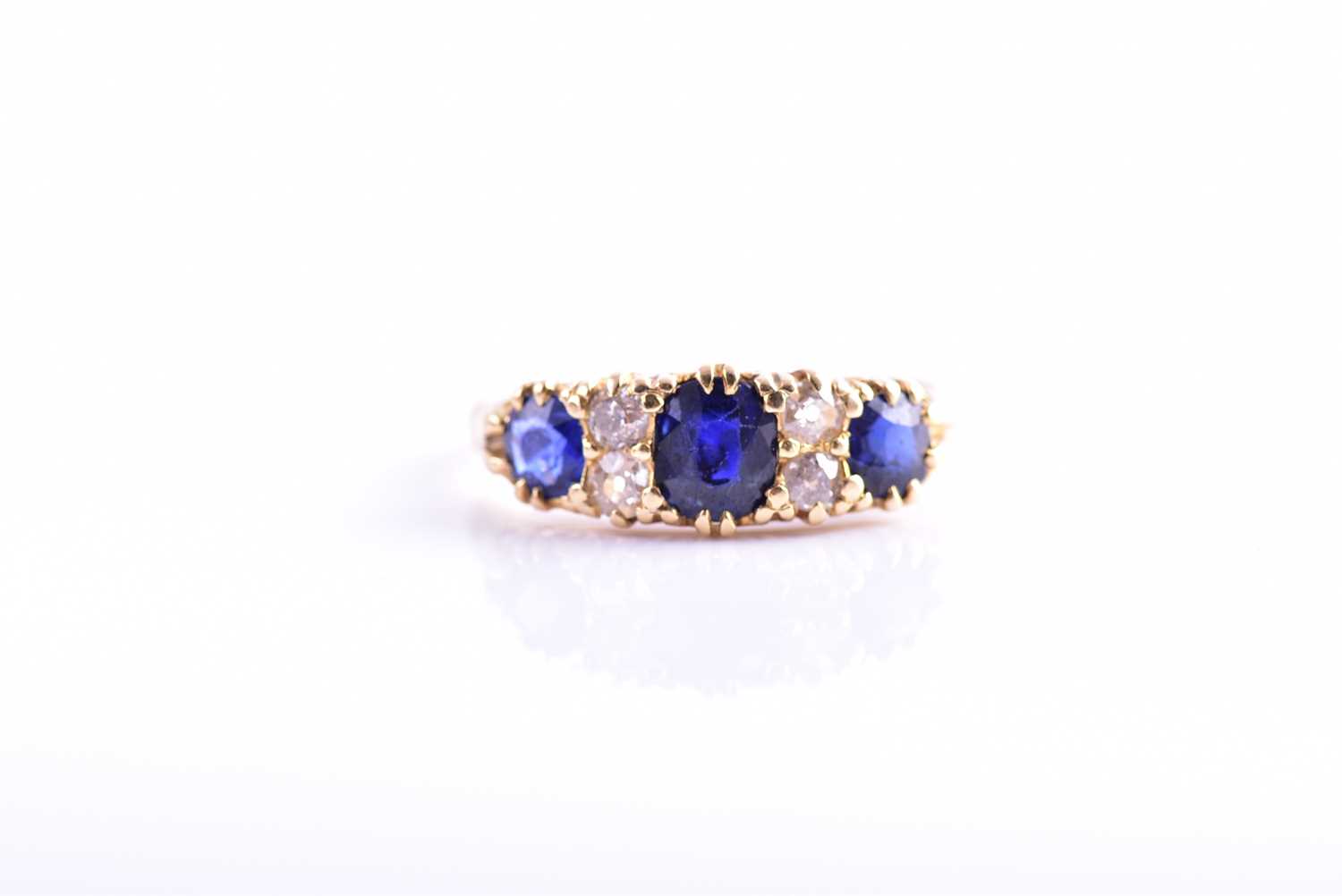 Lot 299 - An 18ct yellow gold, diamond, and sapphire...