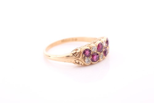 Lot 14 - An 18ct yellow gold, diamond, and ruby ring,...