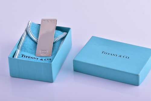 Lot 307 - Tiffany & Co. A silver money clip, marked 1837...