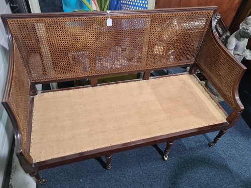 Lot 75 - A George IV three-seat Bergere settee with...