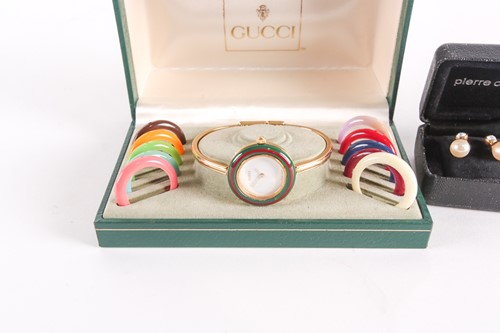 Lot 25 - A Gucci lady's gold plated watch with quartz...