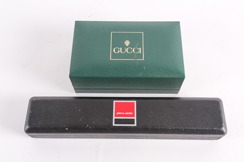 Lot 25 - A Gucci lady's gold plated watch with quartz...