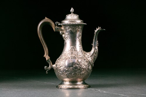 Lot 297 - A George III silver coffee pot. London 1764 no...