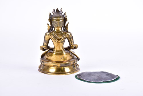 Lot 125 - A Tibetan bronze figure of Tara, Seated in the...