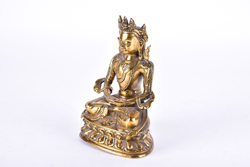 Lot 125 - A Tibetan bronze figure of Tara, Seated in the...