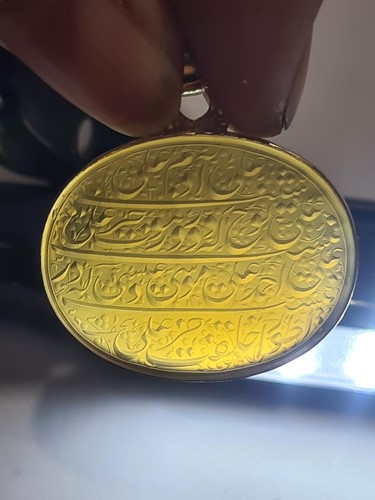 Lot 239 - An Indo Persian hardstone pendant in yellow...