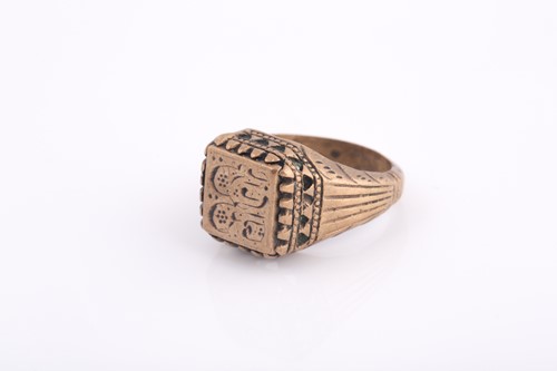 Lot 250 - A base metal Indo Persian gentleman's ring,...