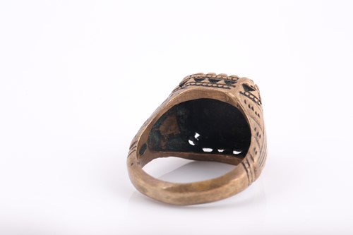 Lot 250 - A base metal Indo Persian gentleman's ring,...