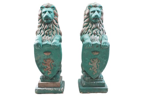 Lot 242 - A pair of large green-painted stone lions,...