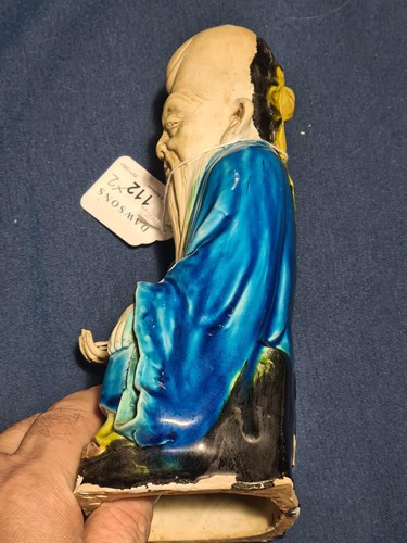 Lot 112 - A Chinese part biscuit porcelain figure of...