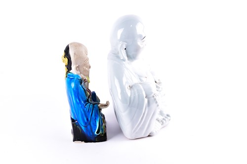 Lot 112 - A Chinese part biscuit porcelain figure of...