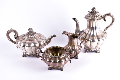 Lot 345 - A Victorian four-piece silver tea set. London...