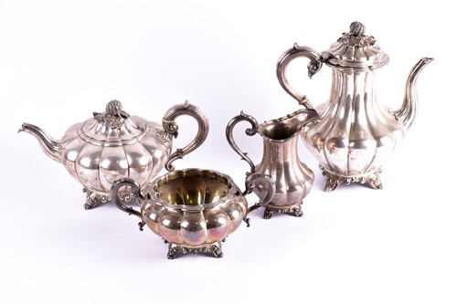 Lot 345 - A Victorian four-piece silver tea set. London...