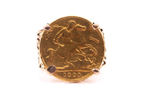 Lot 254 - A yellow metal mounted half sovereign ring...