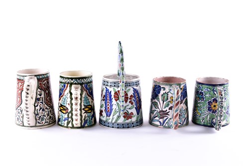 Lot 285 - A collection of Iznik decorated pottery,...