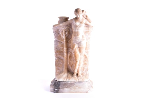 Lot 239 - A carved alabaster lamp base, modelled as an...