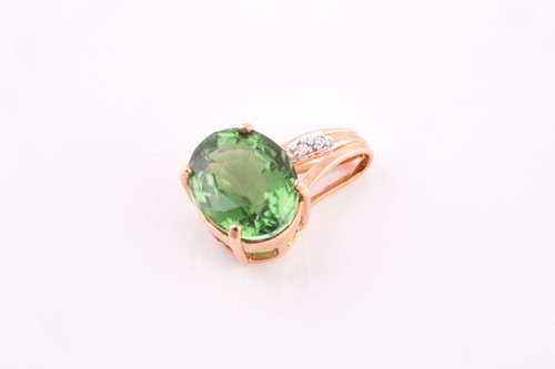 Lot 56 - An 18ct yellow gold, diamond, and green...