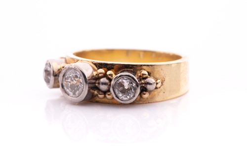 Lot 76 - A yellow metal and diamond ring, collet-set in...