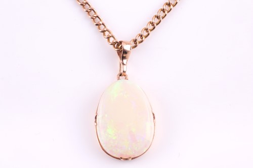 Lot 226 - A yellow metal mounted opal pendant, the...