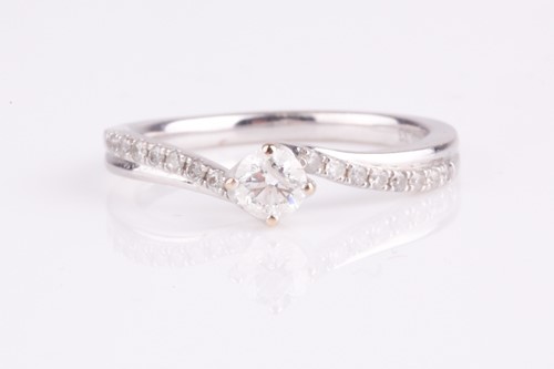 Lot 138 - An 18ct white gold and diamond engagement ring,...
