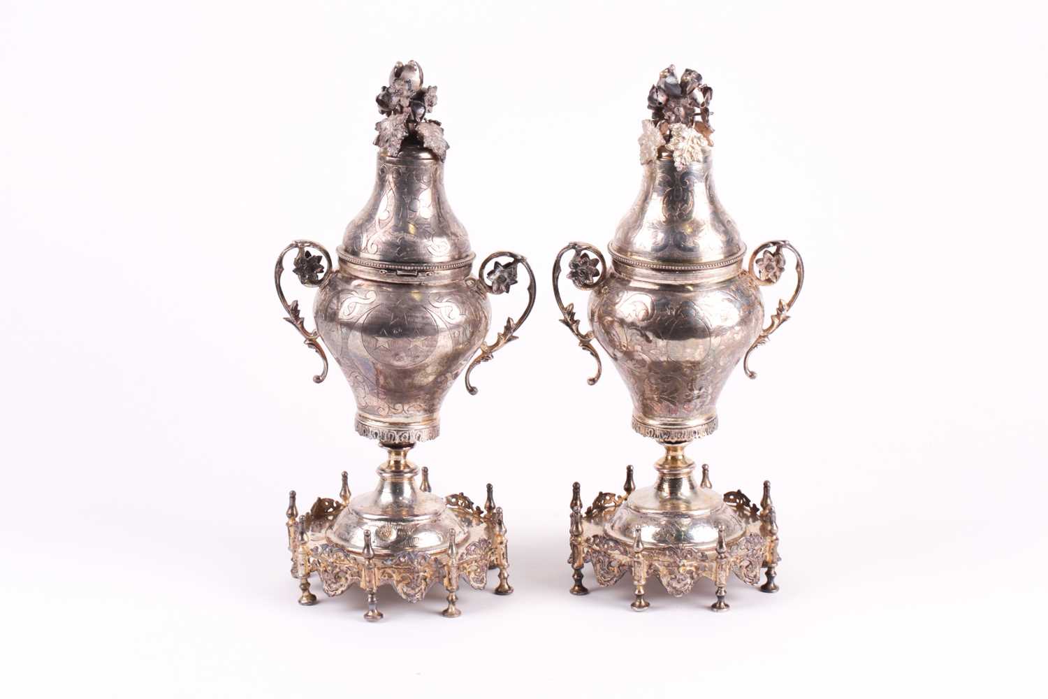 Lot 326 - A pair of Middle Eastern white metal baluster...
