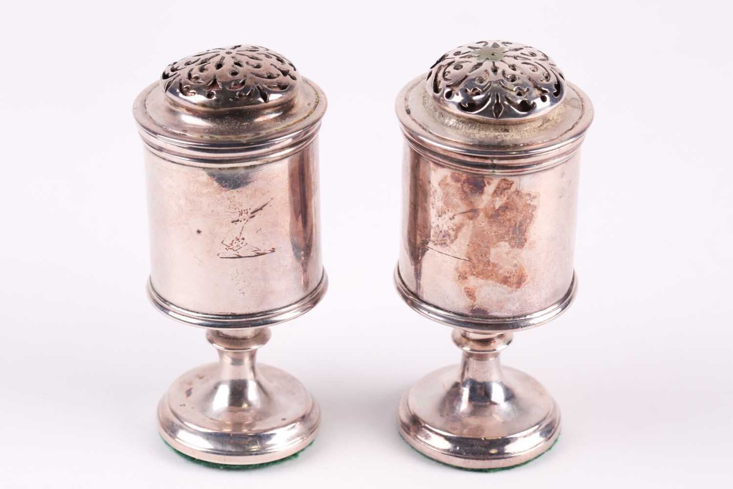 Lot 350 - A pair of Regency silver cylindrical castors,...