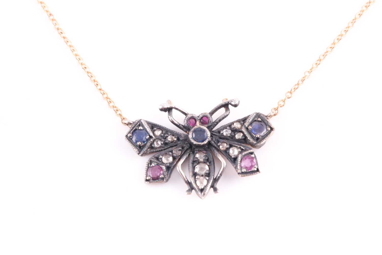 Lot 61 - A diamond and gemstone butterfly pendant, the...