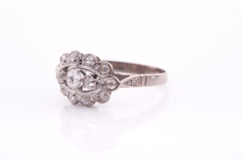 Lot 52 - An 18ct white gold and diamond ring, set with...