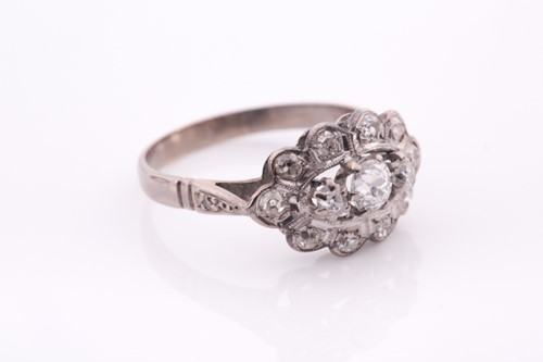Lot 52 - An 18ct white gold and diamond ring, set with...