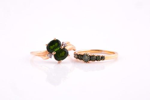 Lot 57 - A two stone chrome diopside cross-over ring...