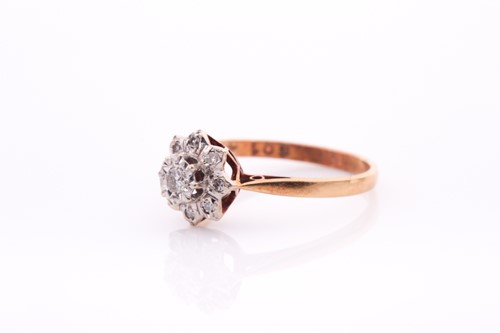 Lot 253 - An 18ct yellow gold and diamond cluster ring,...