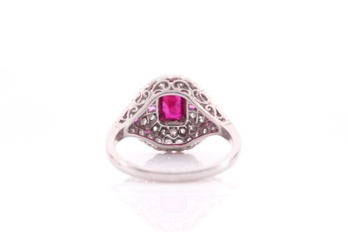 Lot 67 - An Art Deco diamond and ruby ring, inset with...