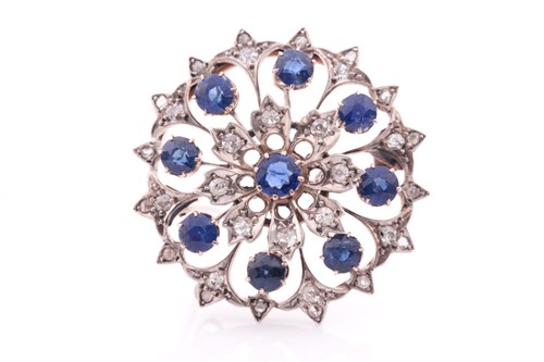 Lot 220 - A diamond and sapphire circular brooch, set...