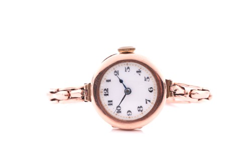 Lot 270 - A ladies yellow metal cocktail watch, the...