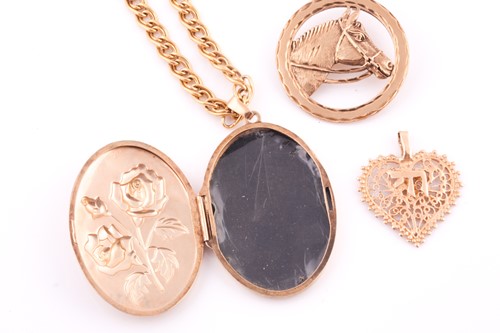 Lot 1 - A two colour 9 carat gold oval locket; with...