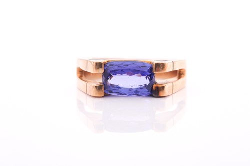 Lot 379 - An 18ct yellow gold and tanzanite ring, set...