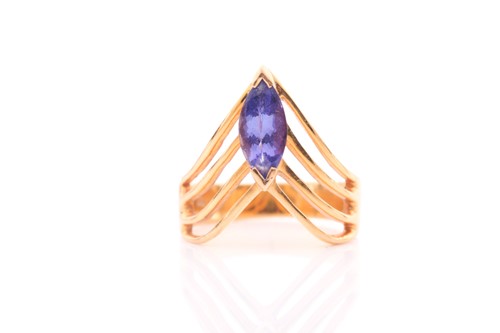 Lot 445 - An 18ct yellow gold and tanzanite ring, the...