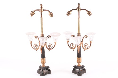 Lot 233 - A pair of French Empire style lamp bases, with...
