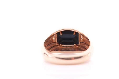 Lot 2 - A gents yellow metal and onyx ring, set with a...