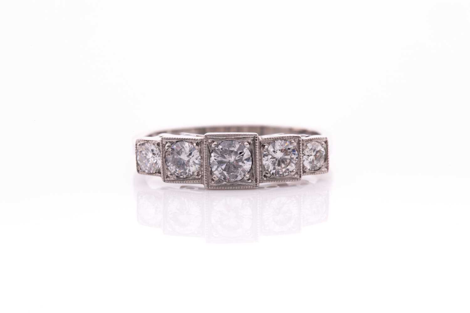 Lot 13 - A platinum and diamond ring, the five...