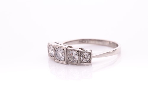 Lot 13 - A platinum and diamond ring, the five...