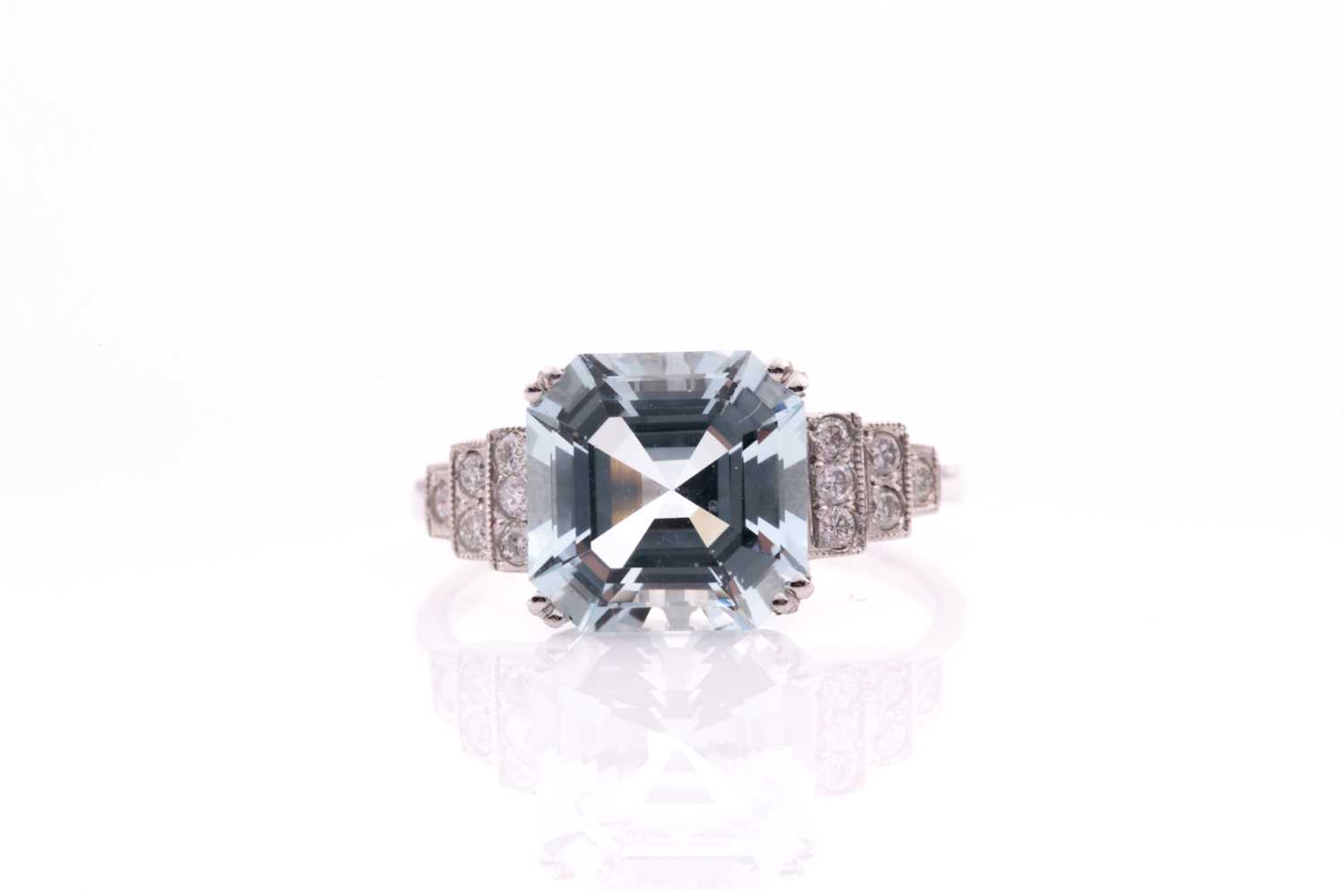 Lot 34 - A platinum, diamond, and aquamarine ring, set...