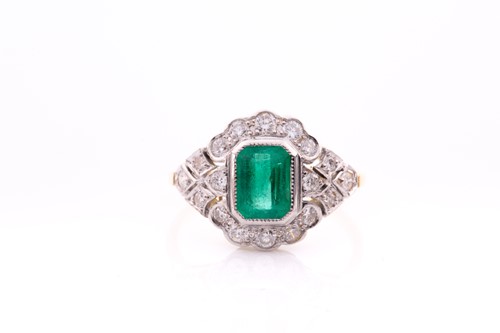 Lot 142 - An 18ct yellow gold, diamond and emerald ring,...
