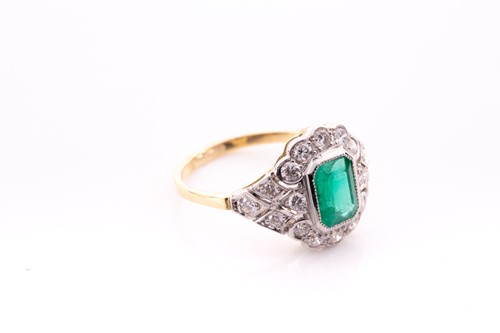 Lot 142 - An 18ct yellow gold, diamond and emerald ring,...