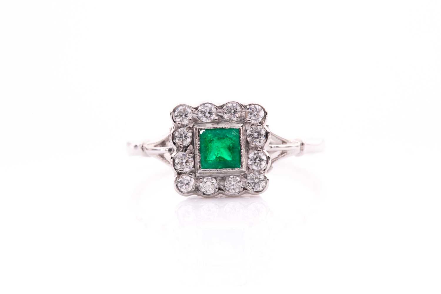 Lot 128 - A platinum, diamond, and emerald ring, set...