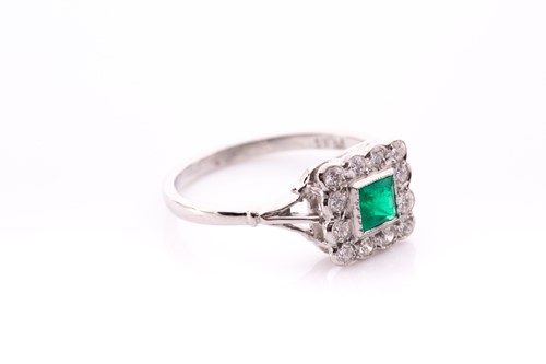 Lot 128 - A platinum, diamond, and emerald ring, set...