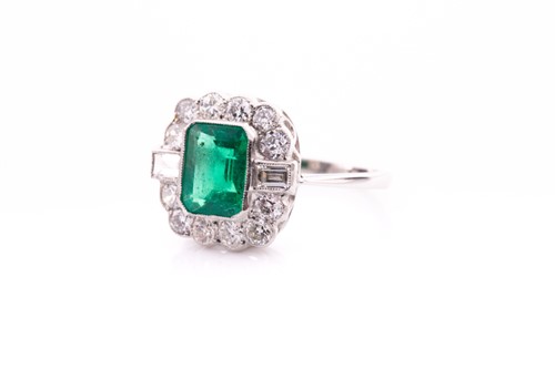 Lot 69 - A platinum, diamond, and emerald ring, set...