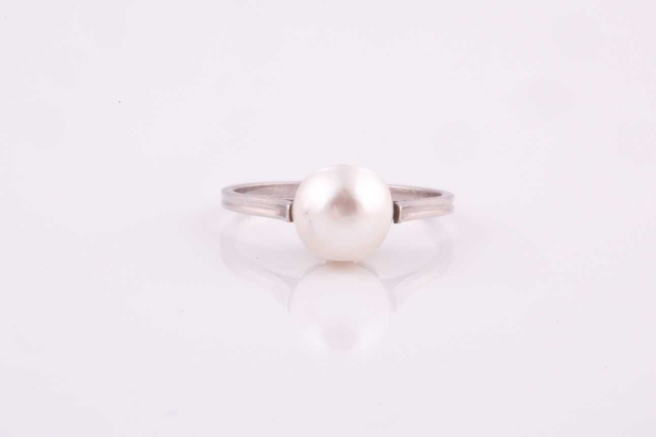 Lot 243 - A natural saltwater pearl ring, the pearl...