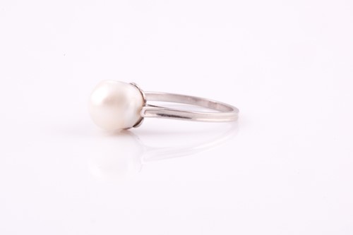 Lot 243 - A natural saltwater pearl ring, the pearl...